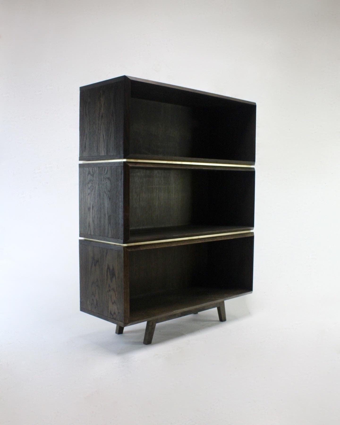 Burnt oak and brass bookcase.